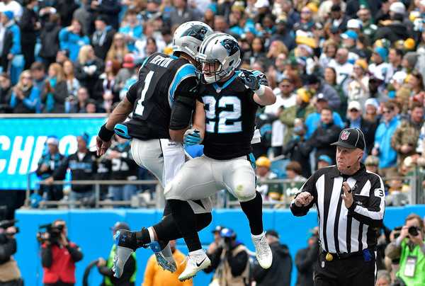 Cam Newton and Christian McCaffery of the Carolina Panthers celebrate during an NFC South matchup