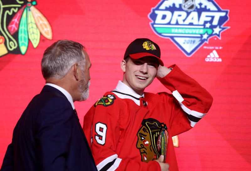 Kirby Dach proudly wears Blackhawks gear after his selection