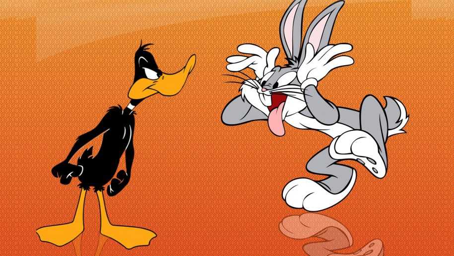 Bugs Bunny making a funny face at Daffy Duck