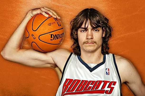 Adam Morrison posing with a basketball