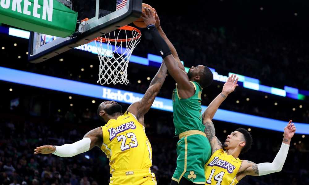 Celtics Playoff Preview and Predictions - BOSTON, MASSACHUSETTS - JANUARY 20: Jaylen Brown #7 of the Boston Celtics dunks over LeBron James #23 and Danny Green #14 of the Los Angeles Lakers at TD Garden on January 20, 2020 in Boston, Massachusetts. The Celtics defeat the Lakers 139-107.  (Photo by Maddie Meyer/Getty Images) ORG XMIT: 775395240 ORIG FILE ID: 1200850305