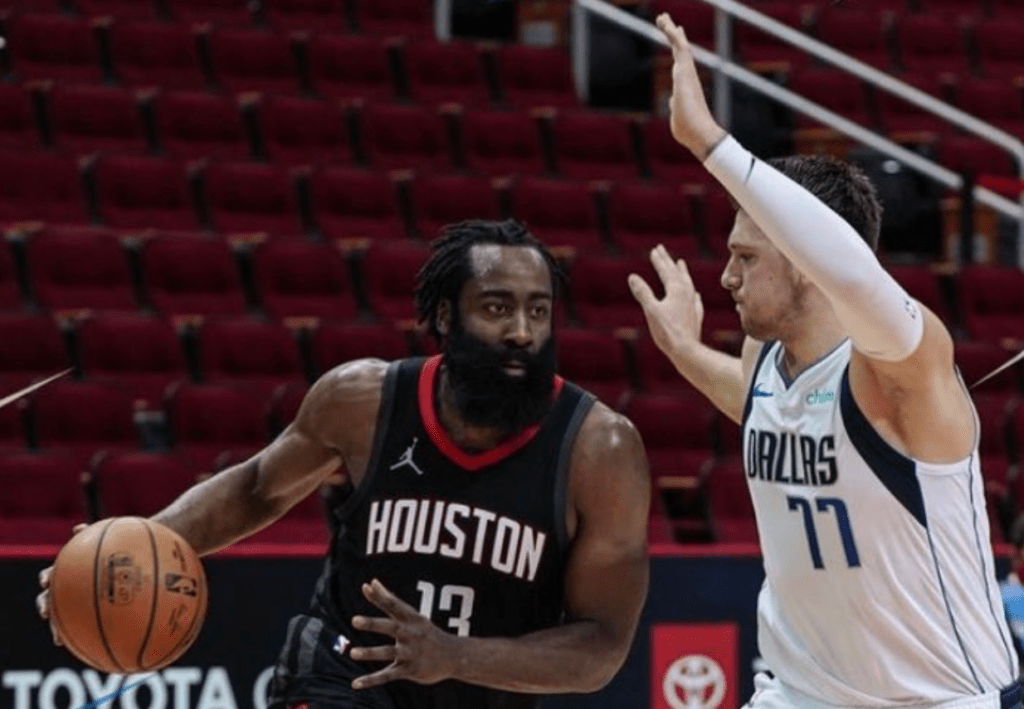 James Harden drives to the rim in his first game back from an ankle injury as the Houston Rockets faced the Mavericks.