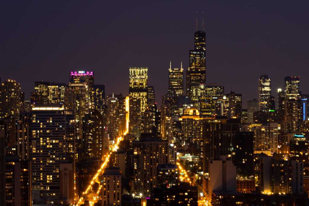 Nighttime photo of Chicago skyline facing south, Willis Tower on the right, Chase Tower on the left. 