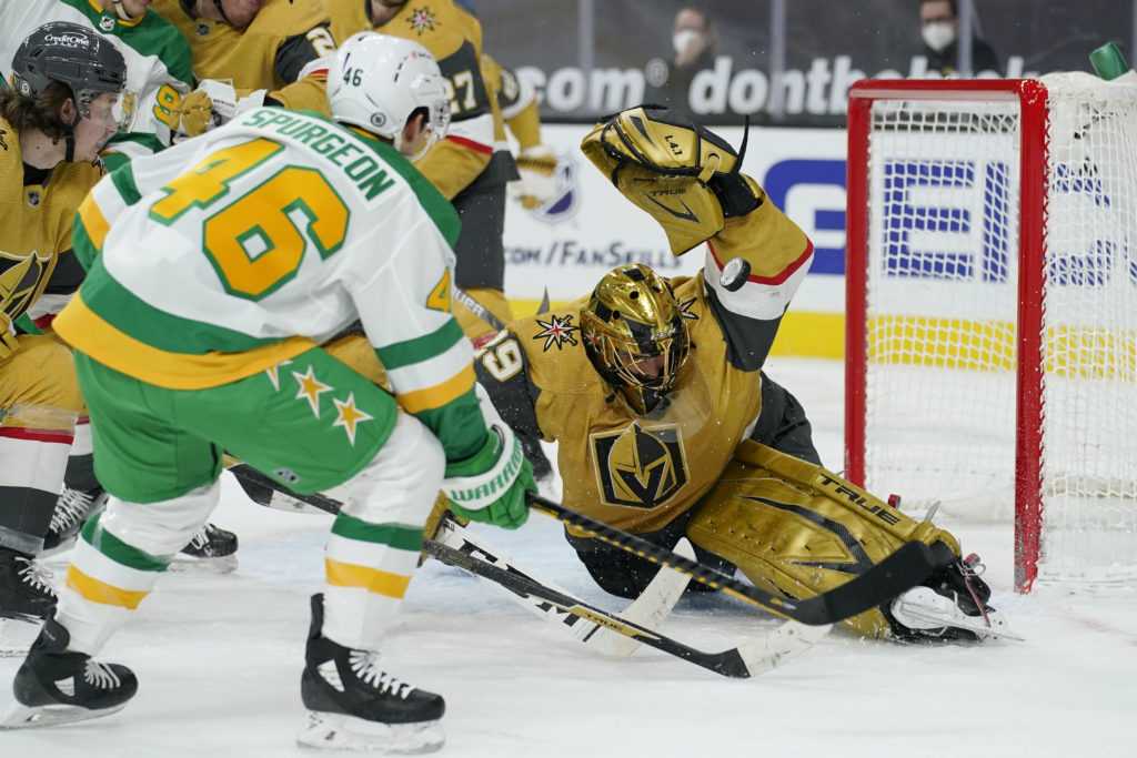 Marc-Andre Fleury making a save from Jared Spurgeon. 