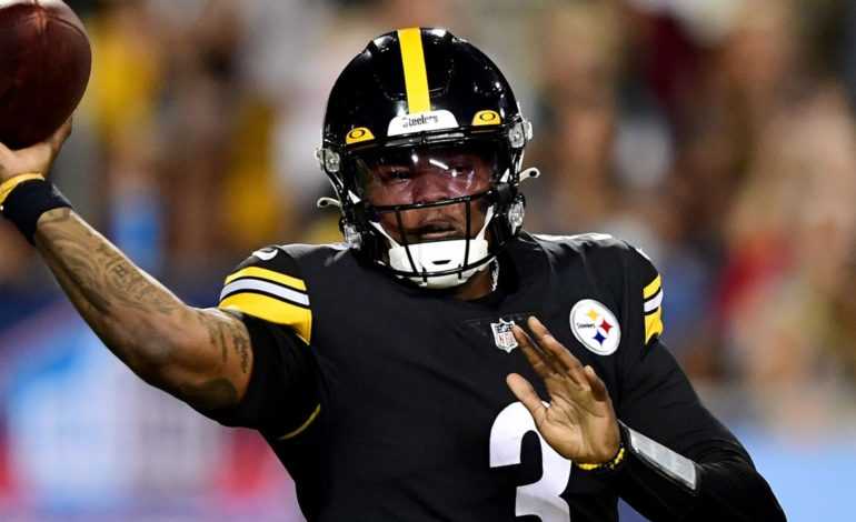 Current Pittsburgh Steelers quarterback Dwayne Haskins throwing the football during a game "pictured here"