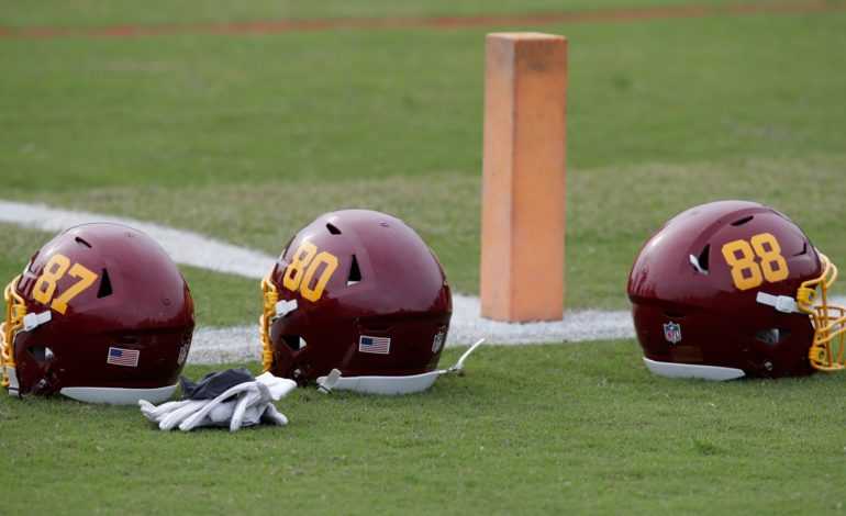 Washington Football Team Helmets Sitting on the sidelines "pictured here"