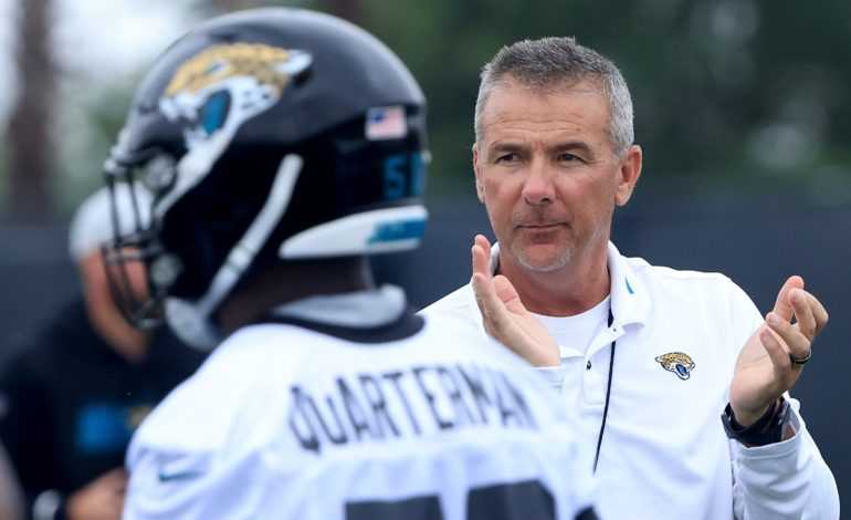 Jacksonville Jaguars and head coach Urban Meyer are under fire for comments on COVID-19 vaccine status playing a role in making the team "pictured here"