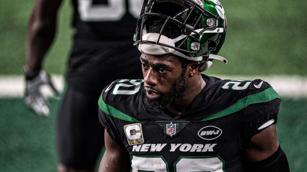 New York Jets safety Marcus Maye with his helmet halfway off during a game. "pictured here"