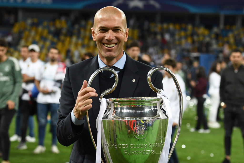 Zidane celebrates with the Champions League trophy.