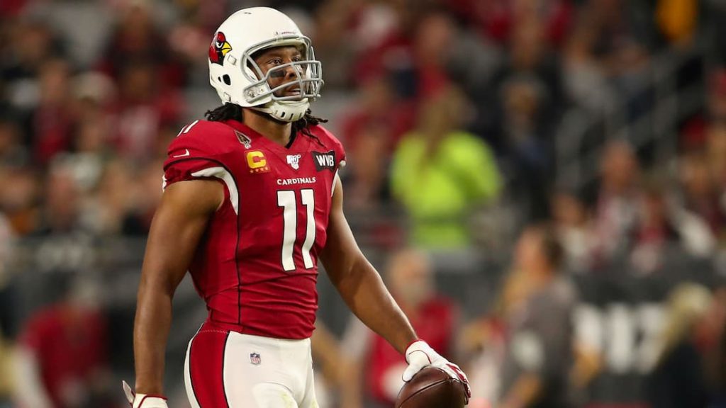 Current free agent wide receiver Larry Fitzgerald holding the ball during a break in a game. 