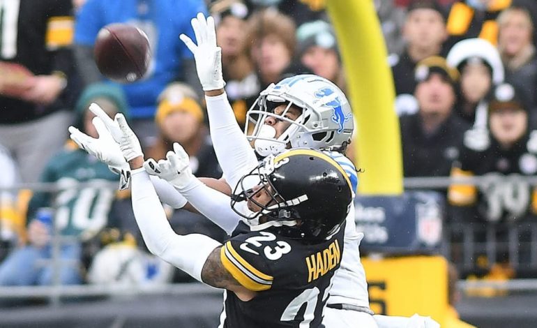 A pass by the Detroit Lions is contested by Pittsburgh Steelers cornerback Joe Haden. "pictured here"