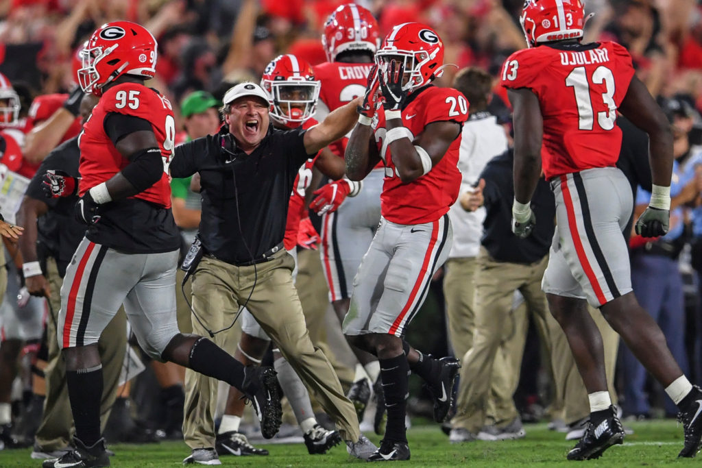 Kirby Smart and the Georgia Bulldogs celebrate a defensive play. Georgia Plays Alabama for the Southeastern Conference Championship.