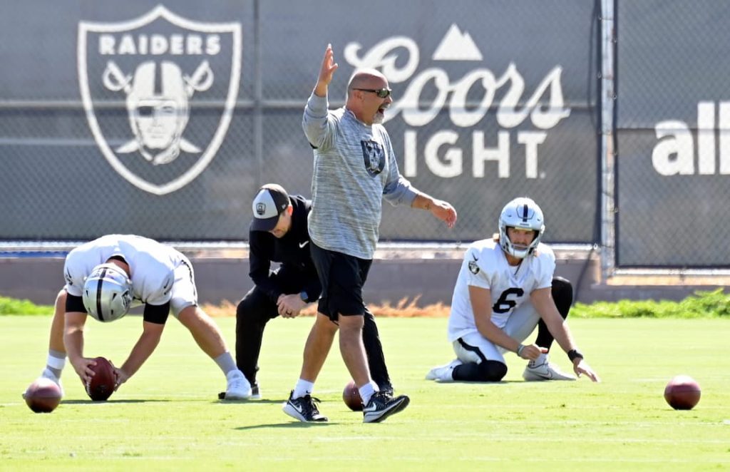 Interim head coach of the Las Vegas Raiders Rich Bisaccia leading the team with specialists practicing placekicking in the background of a practice. "pictured here"
