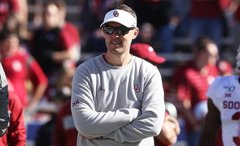 Current Oklahoma Sooners head football coach Lincoln Riley standing on the sideline during a game. "pictured here"