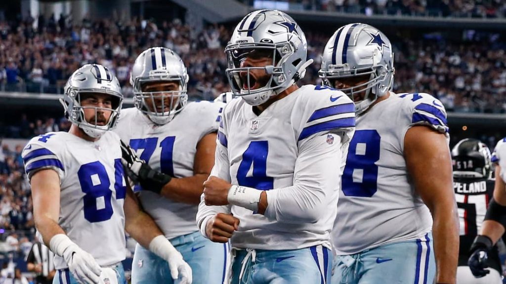Dallas Cowboys quarterback Dak Prescott celebrating with his teammates  during the game against the Washington Football Team in Week 16 of the 2021 NFL season "pictured here"