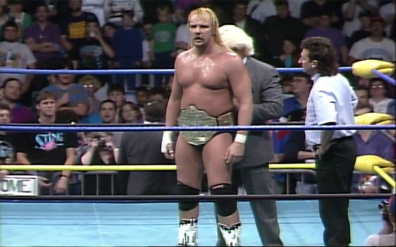 Ric Flair secures the NWA Title around the waist of Barry Windham