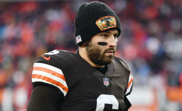 Cleveland Browns quarterback Baker Mayfield on the field wearing a beanie during warmups before a game. "pictured here"