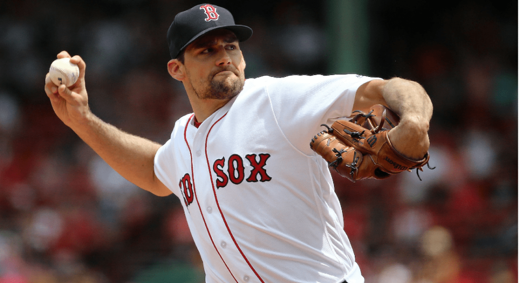 Nathan Eovaldi is repeating his ace-like 2021 but is being wasted by the lineup. Pictured: Nathan Eovaldi pitching in Red Sox home white jerseys. 