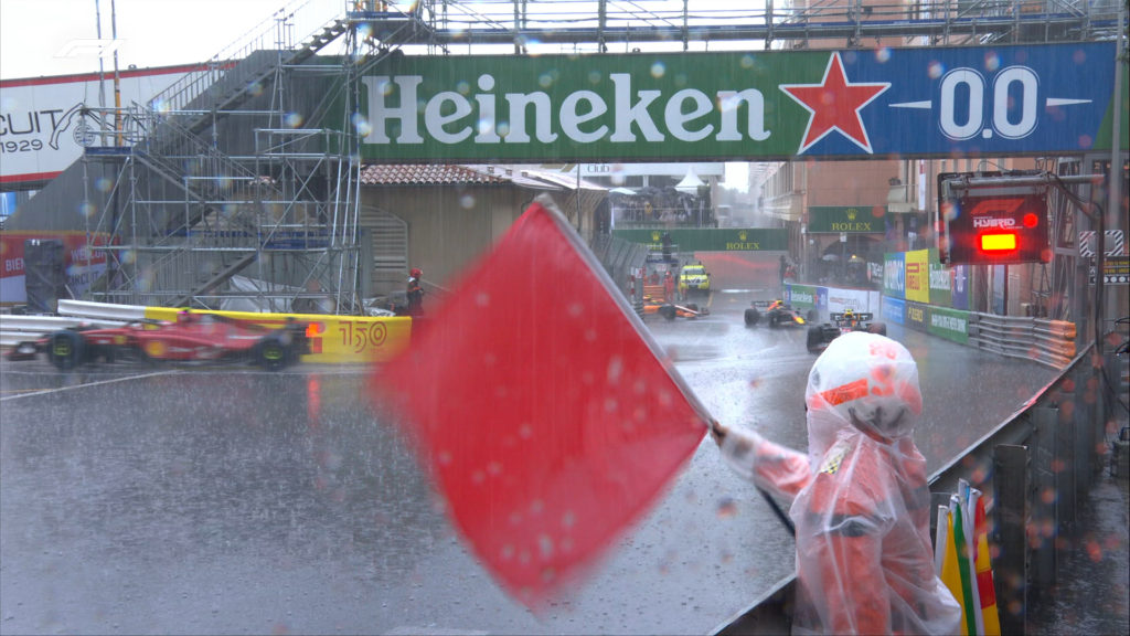 Race marshalls waving the red flag due to intense rain at the 2022 Monaco GP (Source: Twitter @F1)