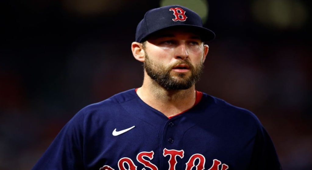 Red Sox Michael Wacha is poised for regression at some point. Pictured: Michael Wacha in Red Sox blue alternate jerseys with red lettering that reads Boston with white outlining. 