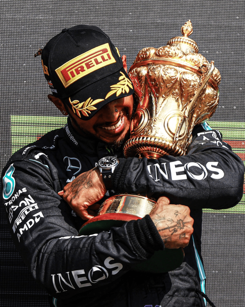 Lewis Hamilton hugged his eighth British GP Trophy in 2021. (Source: Twitter @odibets)
