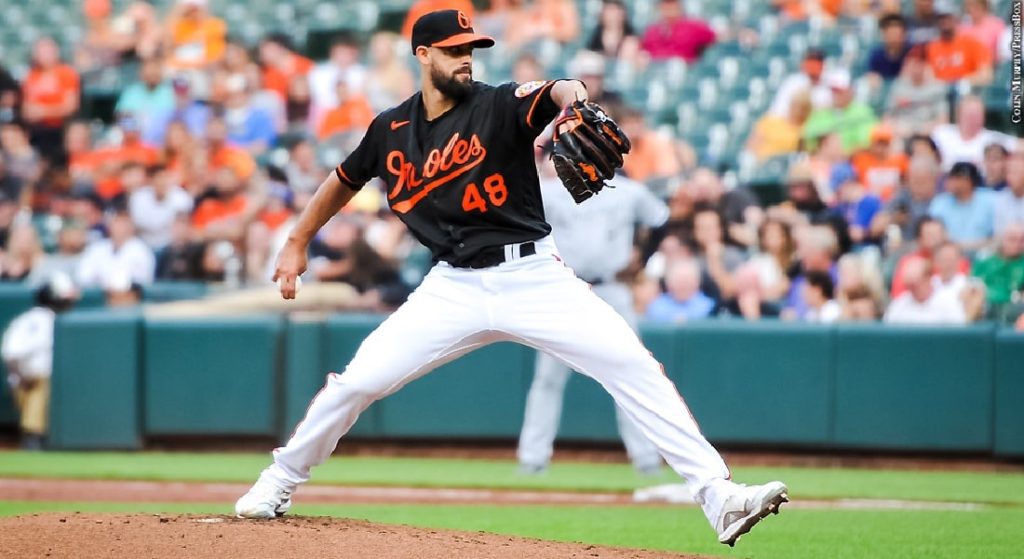 Jorge López would be a nice acquisition for the Red Sox at the trade deadline if they miss out on other available closers. Pictured: Baltimore Orioles pitcher Jorge López in a black jersey top with orange lettering and white pants with a black cap with an orange bill and orange O's logo. 