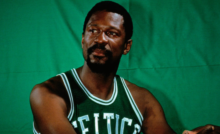The iconic photo of Bill Russell in his playing days with the green background.