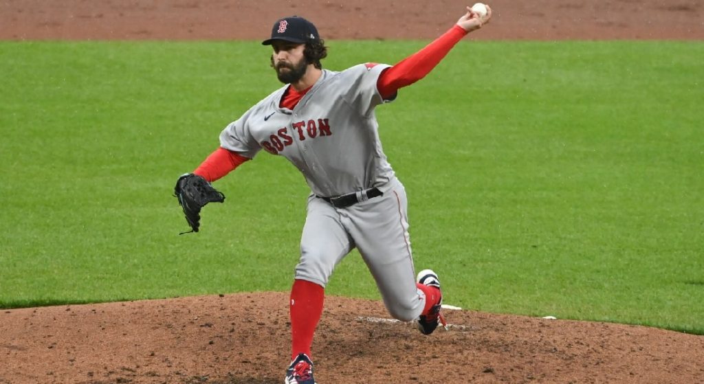Austin Davis pitching on the road in Boston's grey jersey with red lettering. 