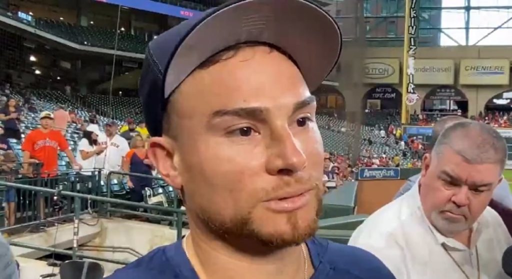 Pictured: Christian Vasquez, with a look of disbelief upon his face, swarmed by media a Minute Maid Park moments after the news of his trade to the Astros broke.  