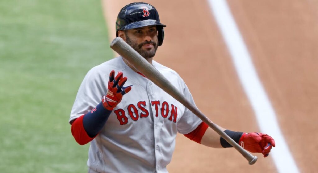 Boston Red Sox' J.D. Martinez tosses bat into the air after an at bat. 