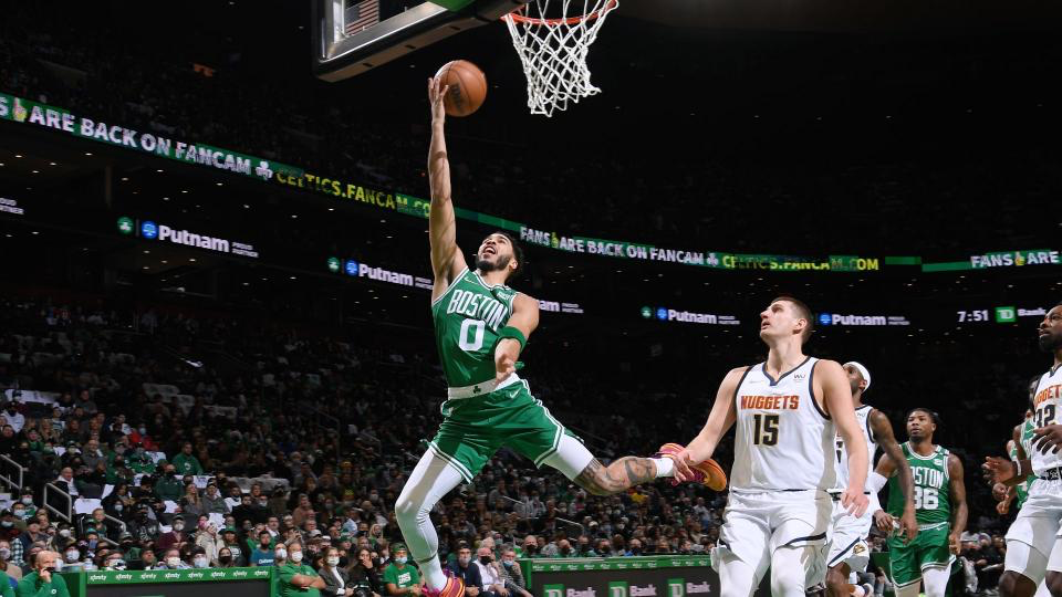 Celtics Jayson Tatum finishing a layup.