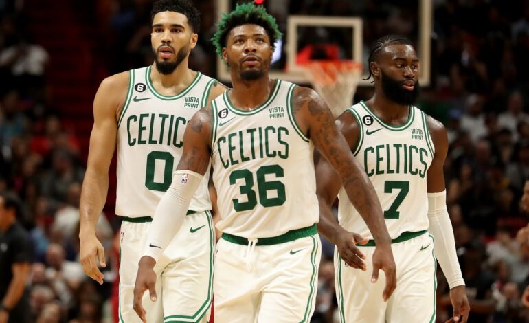 Boston Celtics members Jayson Tatum, Marcus Smart, and Jaylen Brown