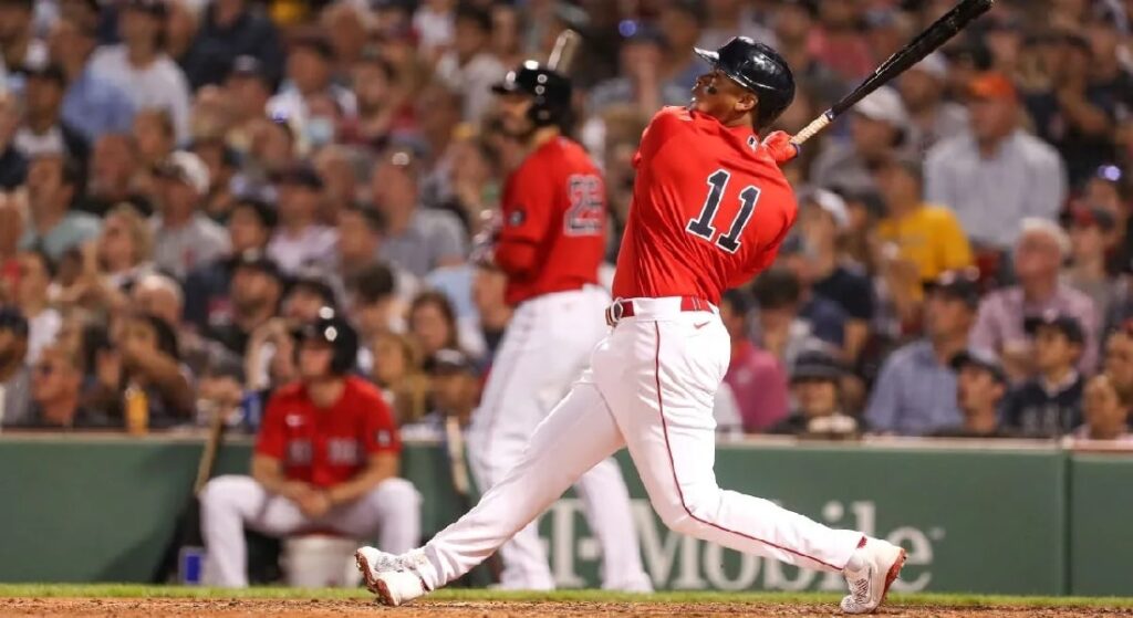 Red Sox had to give a contract extension to Rafael Devers, pictured taking a big swing at Fenway Park. 