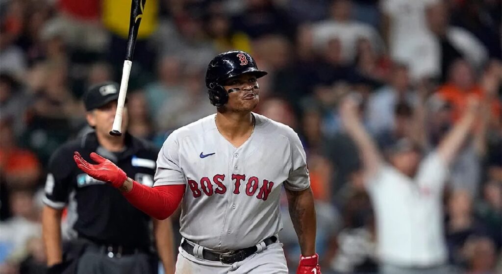 Rafael Devers, pictured flipping his bat in celebration, poised to lead the next great Red Sox team after agreeing to an 11-year contract extension. 