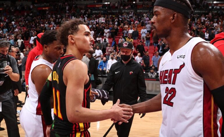Jimmy Butler and Trae Young shaking hands
