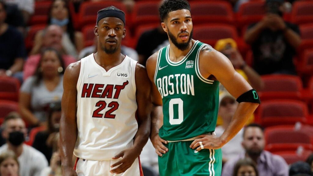 Heat Jimmy Butler and Celtics Jayson Tatum awaiting the ball to be put in play.