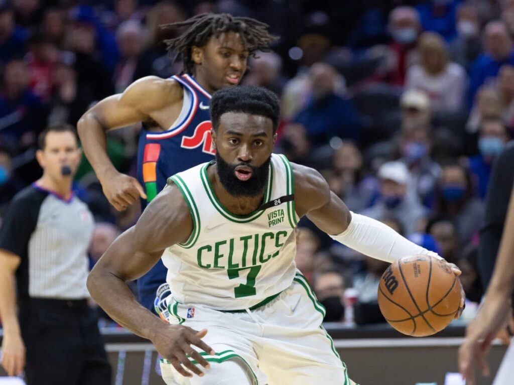 Celtics Jaylen Brown blowing by Sixers Tyrese Maxey