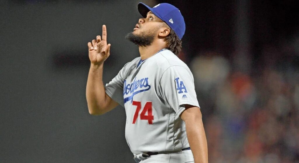 Kenley Jansen, in a Dodger uniform, points to the sky. The Red Sox version of Jansen began after 2020 with L.A. 