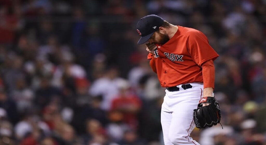 News broke Monday that Red Sox DFA Ryan Brasier, pictured wiping his face as he walks off the mound at Fenway. 
