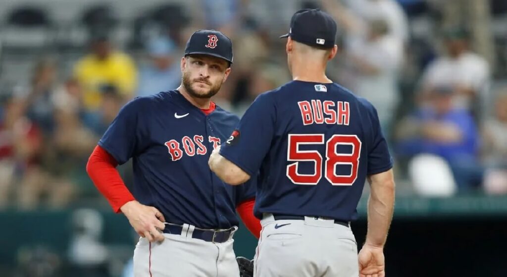 Pictured: Red Sox pitching coach Dave Bush talks to Ryan Brasier