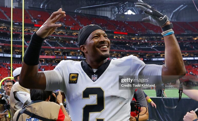 Jameis Winston smiles at the crowd after a game with the New Orleans Saints.