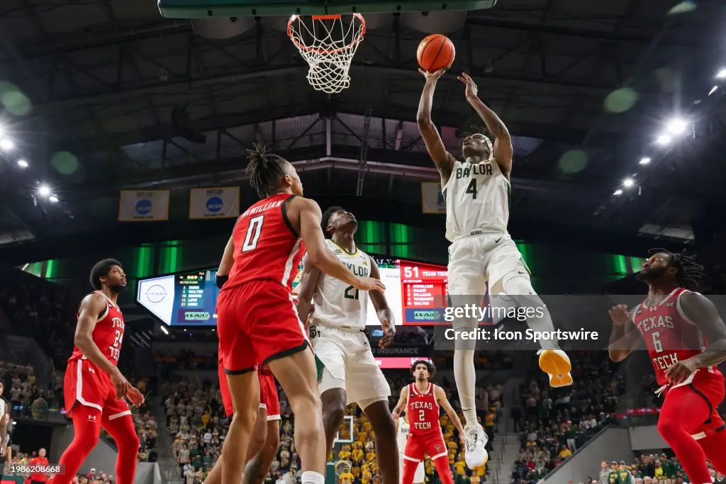 Baylor Bears guard Ja'Kobe Walter (4) puts back a rebound for a basket during the Big 12 college basketball game between Baylor Bears and Texas Tech Red Raiders on February 6, 2024, at Foster Pavilion in Waco, Texas. (Photo by David Buono/Icon Sportswire via Getty Images)