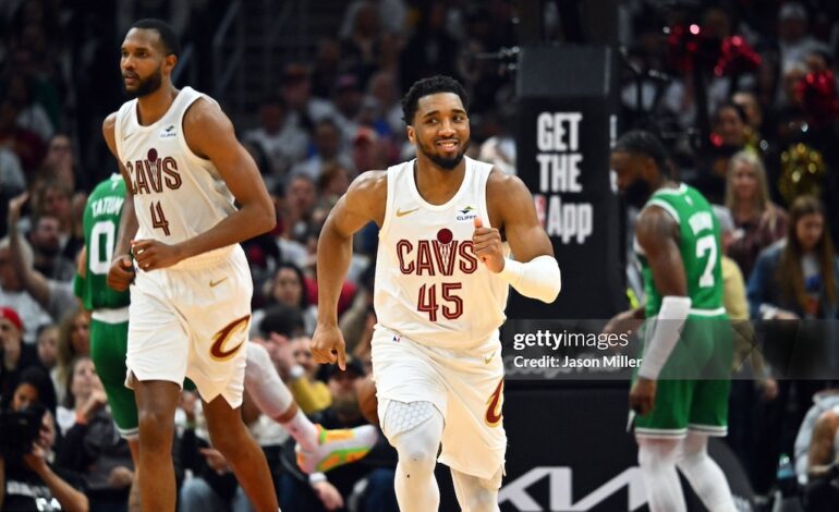 Cleveland Cavaliers' Evan Mobley and Donovan Mitchell.